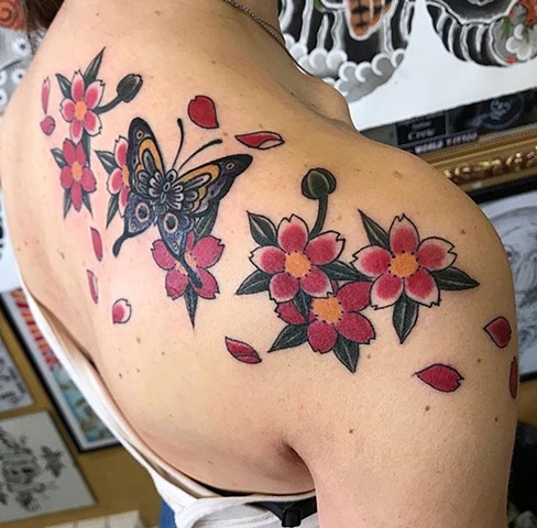 butterfly tattoo flower tattoo strange world tattoo calgary alberta canada colour tattoo 