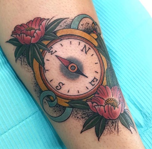 compass with flower tattoo in bright, bold colour Strange World Tattoo Calgary Alberta Canada 