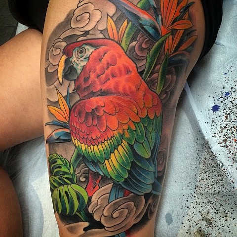 Tattoo of parrot tropical theme
