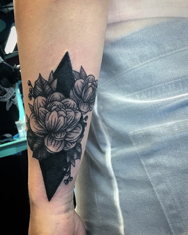 line-work flower tattoo