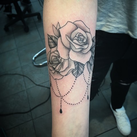 black and grey rose tattoo at Strange World Tattoo in Calgary, Alberta