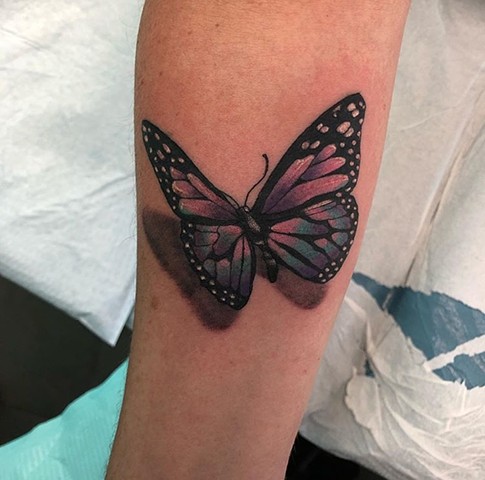 Butterfly tattoo Strange World Tattoo Calgary 