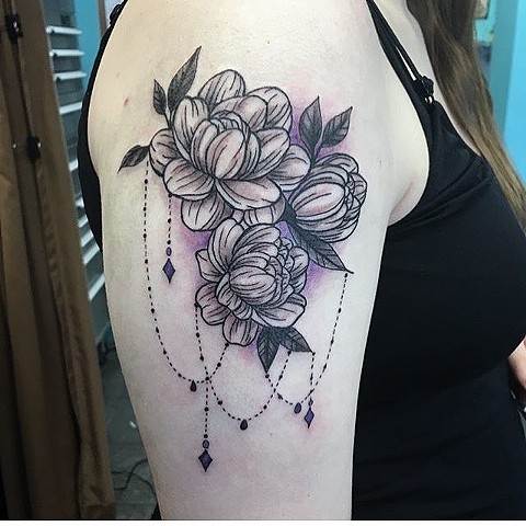 Pretty black and grey flowers by the tattoo artist Kristin of Strange World Tattoo in Calgary