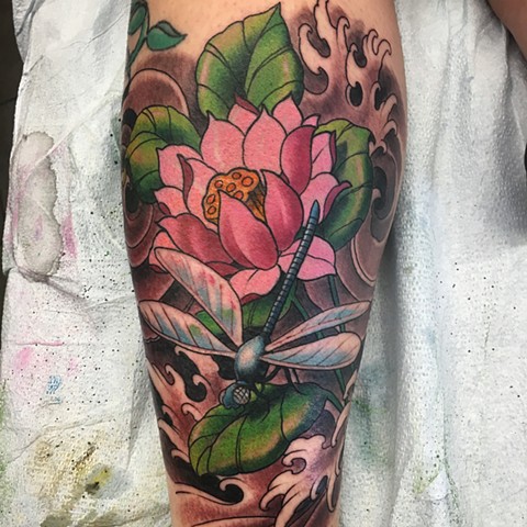 Colour dragonfly and flowers with black and grey background tattoo by artist Brett Schwindt at Strange World Tattoo in Calgary, Canada