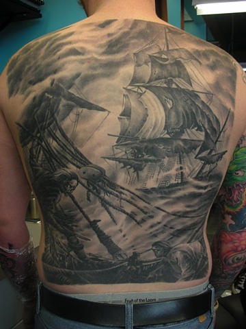 Black and grey tattoo backpiece of ships 