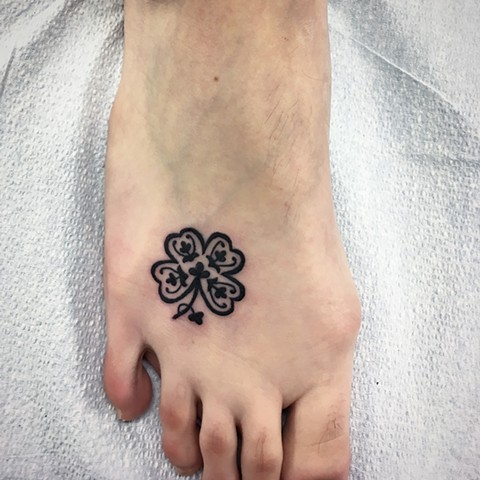 four leaf clover tattoo at Strange World Tattoo in Calgary