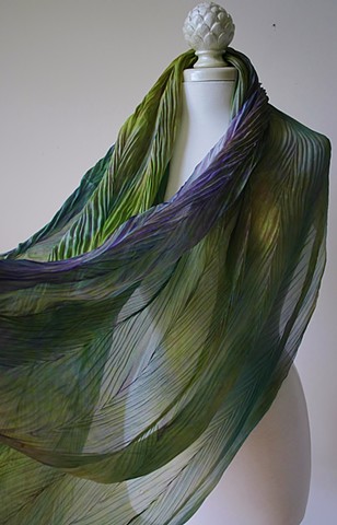 Shibori dyed silk scarves in  shades of green and purple