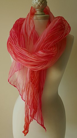 Shibori dyed silk scarf in shades of pink and coral