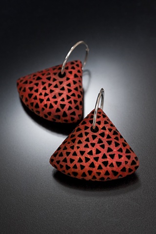 Red driftwood triangular earrings, with burnt design and silver hoops.