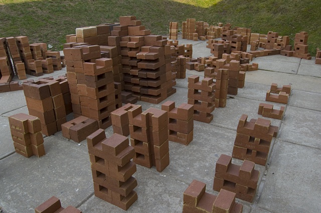 This variation of %Converge% is sited outdoors at the Mainline Art Center, Haverford, PA and is composed of 912 modular bricks in 211 variations and 9 permutations. 