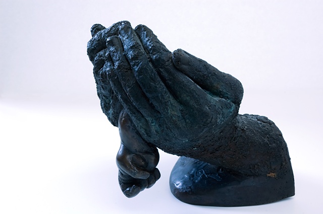Bronze sculpture hands child birth art