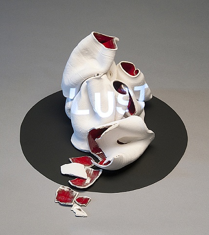 Wheel thrown and altered ceramic vessels with projected text "Lust" by Linda S Fitz Gibbon