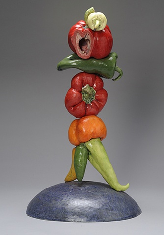 ceramic figure composed of peppers by Linda S Fitz Gibbon