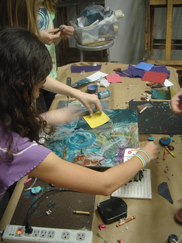 kids making monoprints on a hot palette