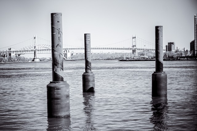 Photograph of Marine Pillars, East River, RFK Bridge, and Hell Gate Bridge, Manhattan, NY, by Judith Ebenstein