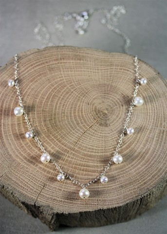 long pearl charm necklace