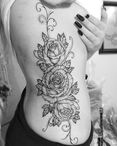 Side flower tattoo