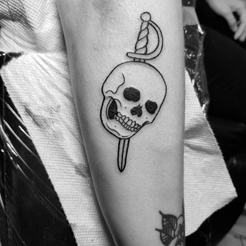 Skull and sword tattoo