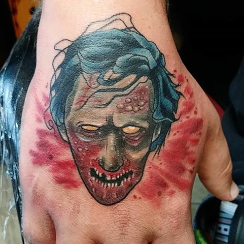 Zombie head, zombie head tattoo, hand tattoo, Kissimmee tattoo, Kissimmee tattoo shop, tattooshop, tattooing 