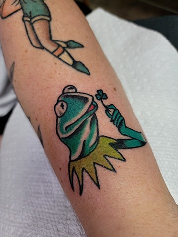 Kermit the frog traditional tattoo on forearm by Gina Matsuo of Copper fox tattoo in Kissimmee Florida best tattoo shop near me