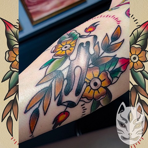 Traditional style candle tattoo with flowers on forearm in full color by Gina Matuo of Copper Fox Tattoo in Kissimmee Florida best tattoo shop 