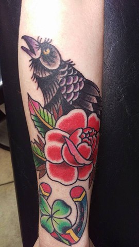 Tradtitional Rose and Raven on lower arm by Gina Marie of Copper Fox in Kissimmee Florida