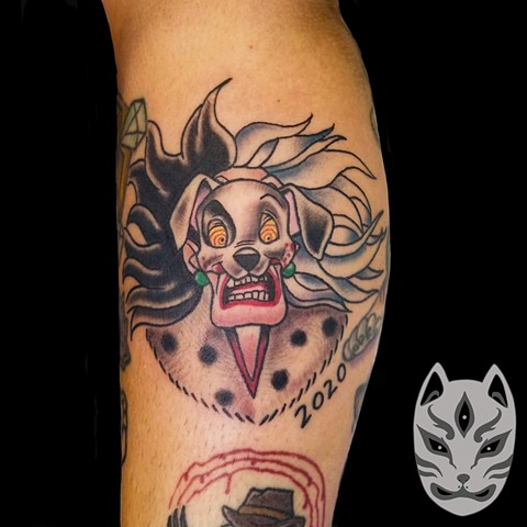 Disney Cruella De Vil from 101 Dalmations tattoo on lower leg in traditional style by Gina Matuo of Copper Fox Tattoo in Kissimmee Florida Disney tattoos from the best tattoo shop