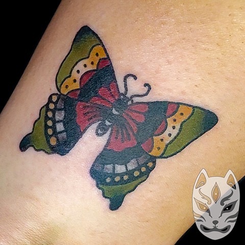 Traditional butterfly on lower leg by Gina Matuo of Copper Fox Tattoo in Kissimmee Florida