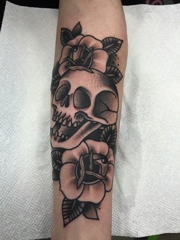 American Traditional Skull with Roses in black and grey by Klint Who of Copper Fox Tattoo in Kissimmee Florida traditional tattoo shop