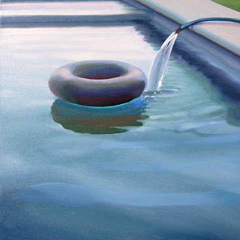 Small Innertube with Hose on Cloudy Day