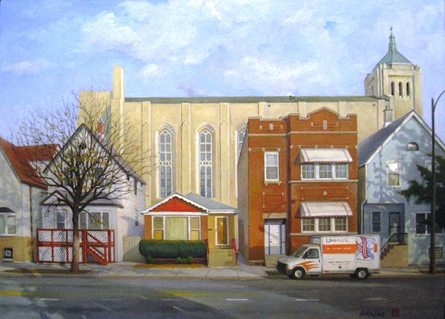 Small Chicago bungalow squeezed between much larger buildings and backed by soaring church, with U-Haul truck by Mary H. Phelan.