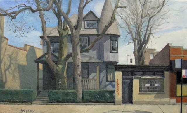 grey victorian house tucked between brick commercial buildings with large trees and strong shadows by Mary Phelan