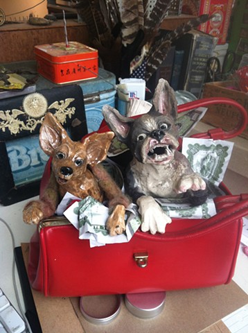 Ceramic boston terrier and chihuahua terrorise a purse
