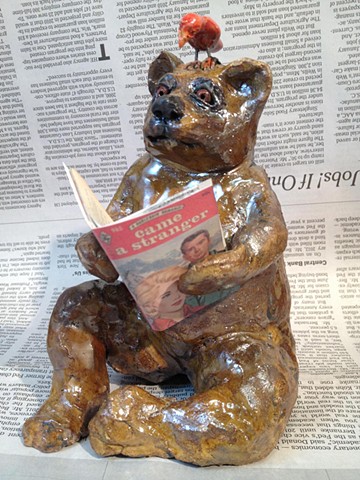 raku bear sharing a smutty read with his bird friend by lisa schumaier