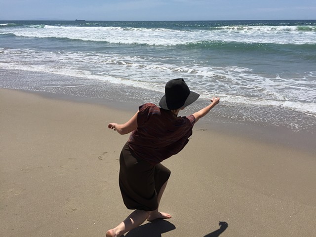 Me skipping my future ashes into the ocean. They have been pressed into rock forms and kiln dried.