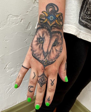 Intuitive Tattoo Art by Female New York Tattoo Artist Amanda Marie Of an owl spirit magick tattoo with moon and snake design details done in black and grey with pops of color
