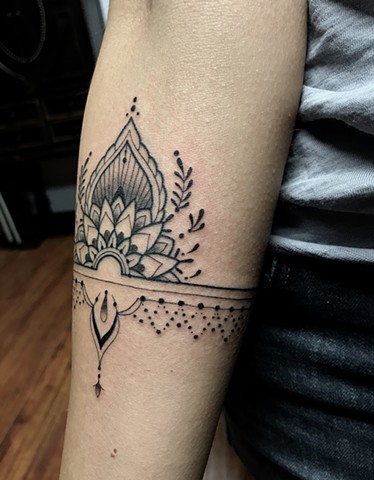 this is a delicate ornamental mandala tattoo inspired by henna done in black and grey by amanda marie female tattoo artist and owner of ace of wands tattoo in san pedro los angeles california in the south bay 