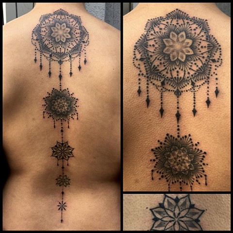 this is an ornate mandala spine tattoo done by amanda marie tattooer at evermore tattoo in culver city los angeles california 