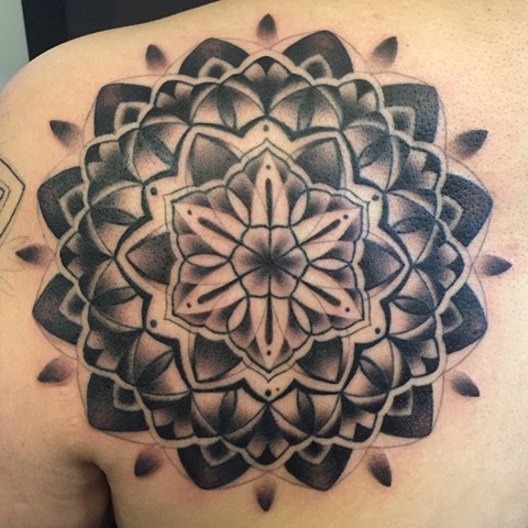this is a black and grey mandala tattooed by female tattooer amanda marie at evermore tattoo company in los angeles california 