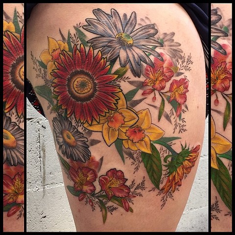 this is a floral tattoo done in a realistic style by amanda marie at evermore tattoo in los angeles california 