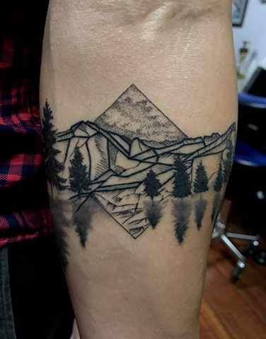 this is  tattoo of mountains that is a travel and sacred spiritual tattoo designed with intention to be grounding healing and to embody the magick of nature and the mountains for my client done by Amanda Marie tattooer at private studio ace of wands tatto