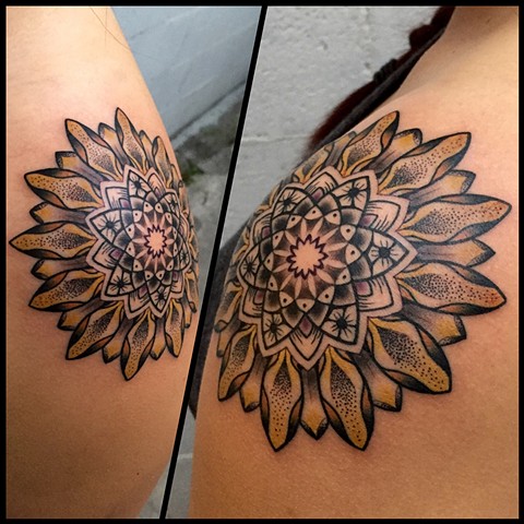 this is a tattoo of a sunflower mandala by amanda marie tattooer she will be at the boston tattoo convention at tattooing in salem Massachusetts 