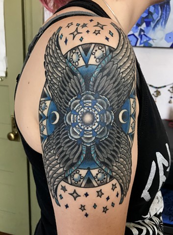 This is a roman shield tattoo done in a mystical style by Amanda Marie lady tattoo artist and tarot reader in Los Angeles California 