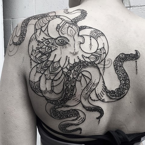 this is a geometric inspired octopus tattoo done by amanda marie tattooer in los angeles california at evermore tattoo 