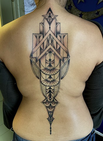 this is an Art Deco architecture inspired back piece done in a minimalist geometric style by Amanda Marie tattoo artist and tarot reader in Los Angeles California
