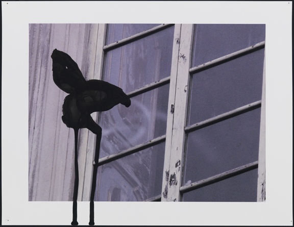 Untitled (window exterior with black shape)