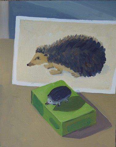 painting of a toy hedgehog in front of a hedgehog postcard