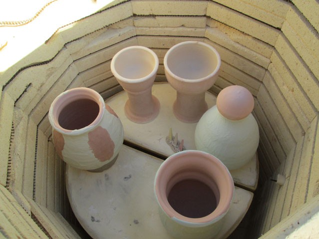 Glazed pottery in the gas kiln before firing.