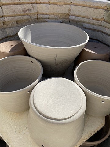 Bisque-firing plant pots in the kiln