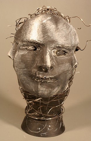 Mask made of Paper Towel, Wood Glue, Wire, Chalkboard paint, Wire and Glass